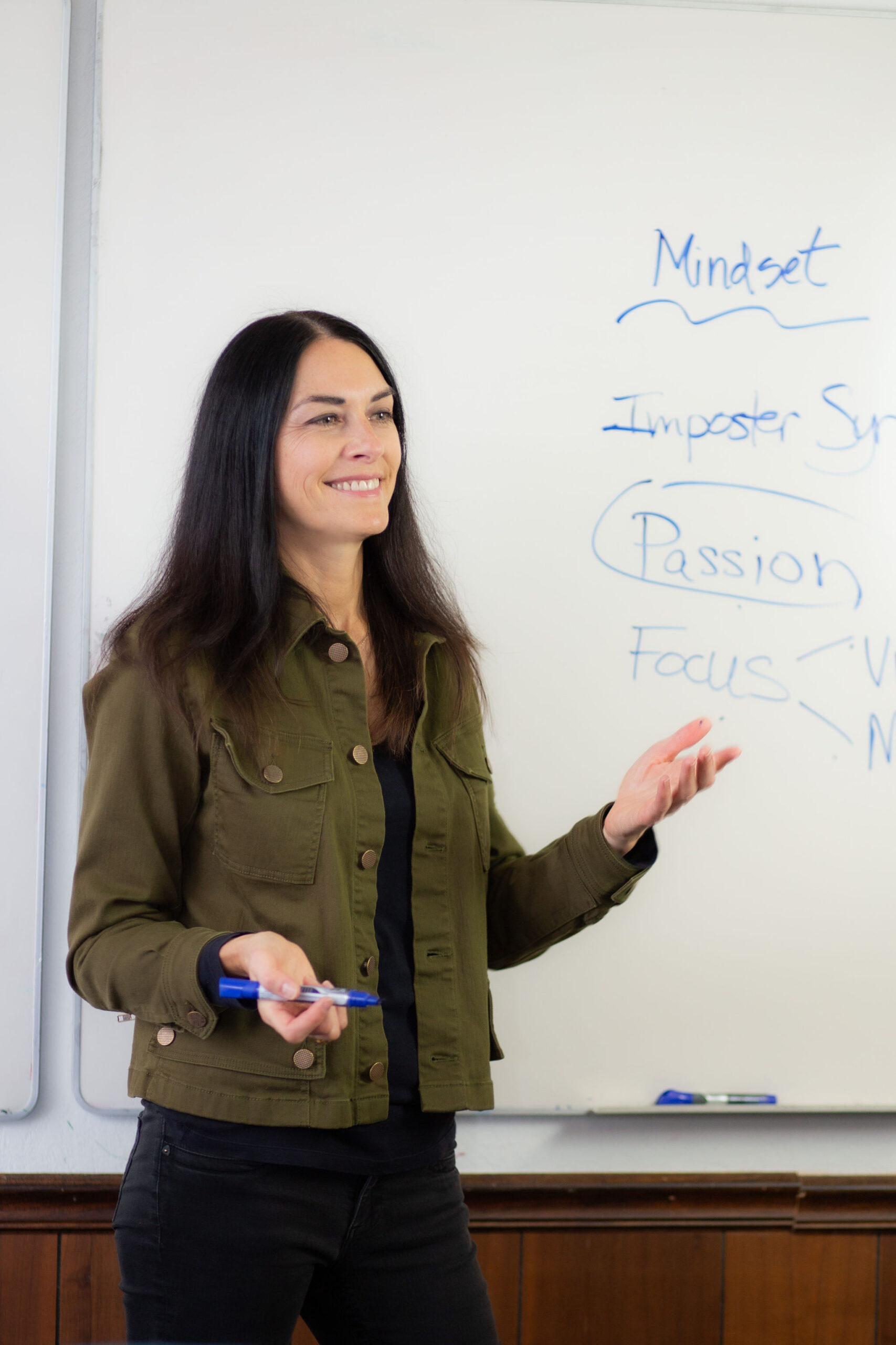 Image: Denise at the whiteboard talking to the audience