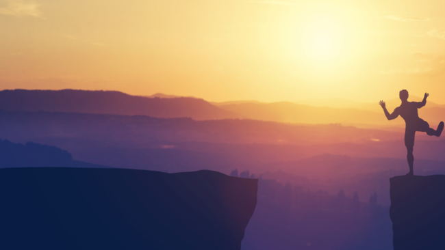 Exploring the Limits of Adventure and Risk-Taking Image: Man about to jump off a cliff