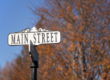 Main Street sign with the outdoors backdrop