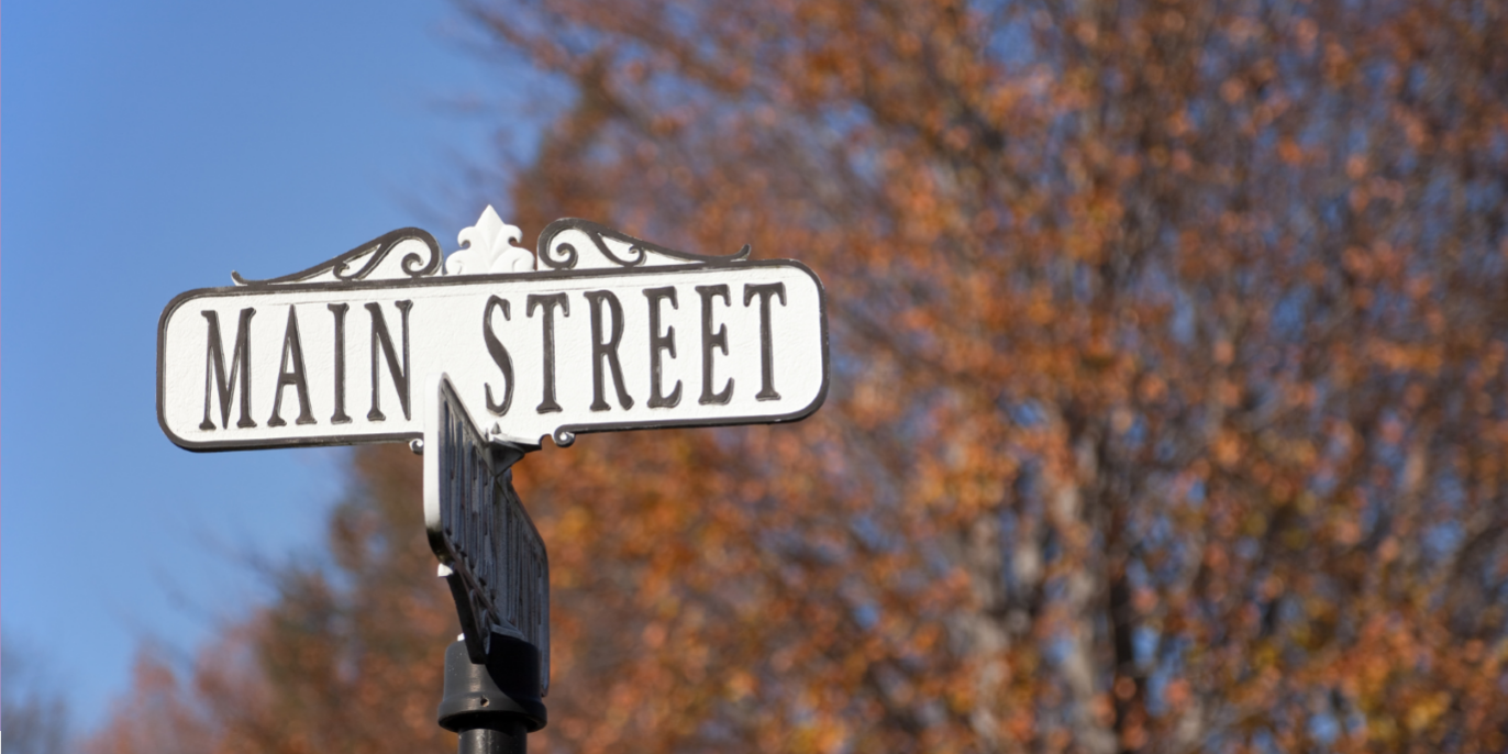 Main Street sign with the outdoors backdrop