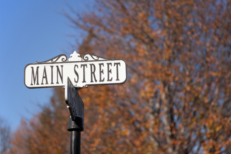 Main Street Main Street sign with the outdoors backdrop