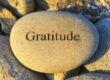 A rock with the word gratitude on it